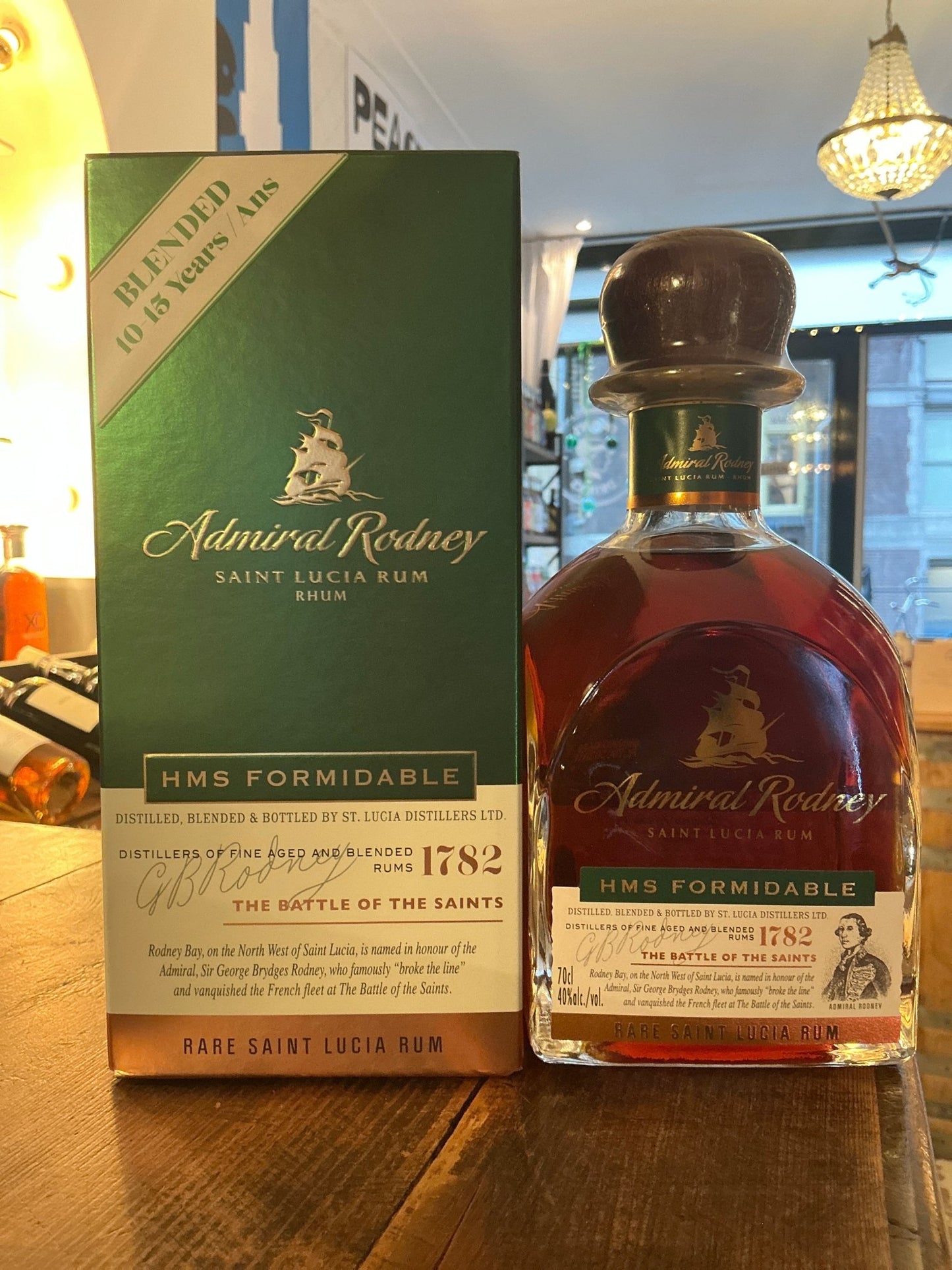 Admiral Rodney HMS Formidable aged rum bottle and green box, premium Saint Lucia distilled spirit with rich amber color and.