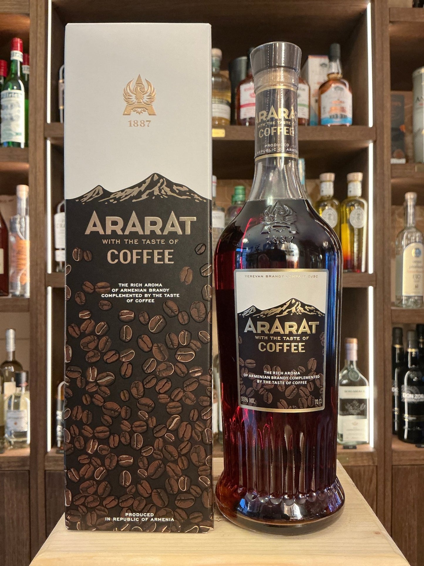Ararat Coffee-infused Brandy Liqueur bottle with dark brown label and gold accents beside matching black and white box with.