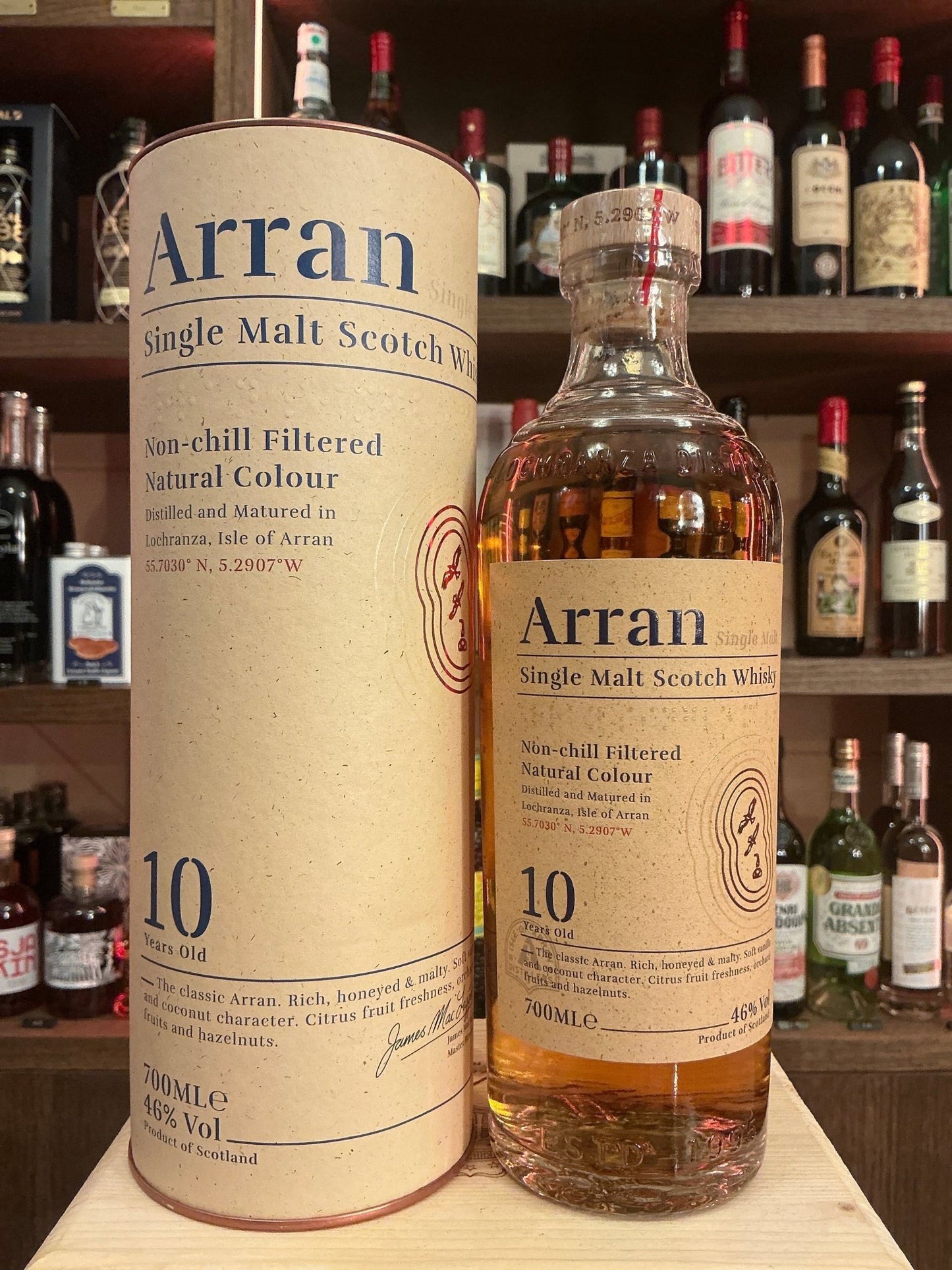 Arran 10 Year Single Malt Whisky bottle and beige cylindrical packaging with black text, premium aged artisan spirit with.