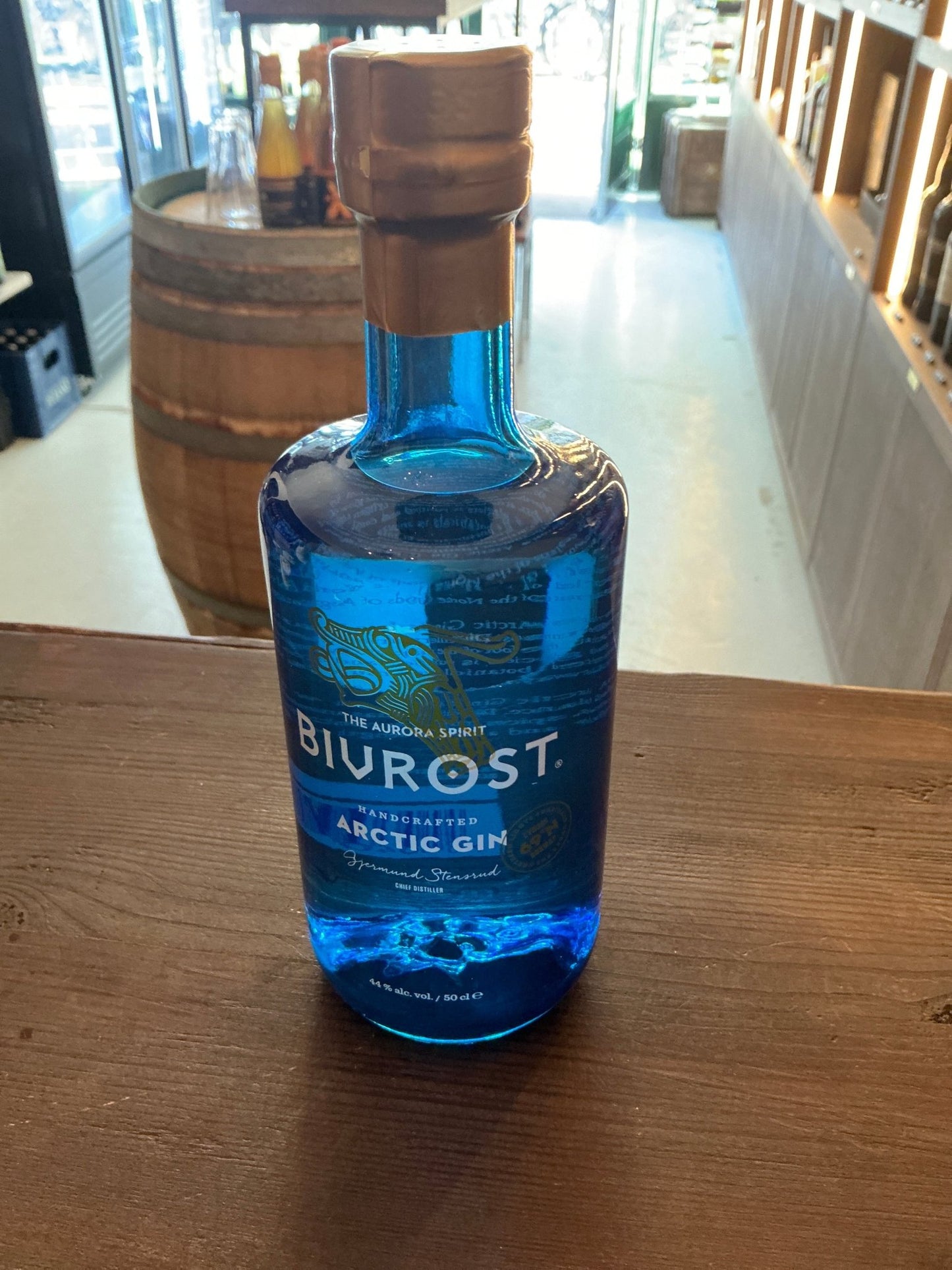 Bivrost Arctic Gin blue glass bottle with wooden cap, premium distilled botanical spirit from Norway, artisan small batch gin.