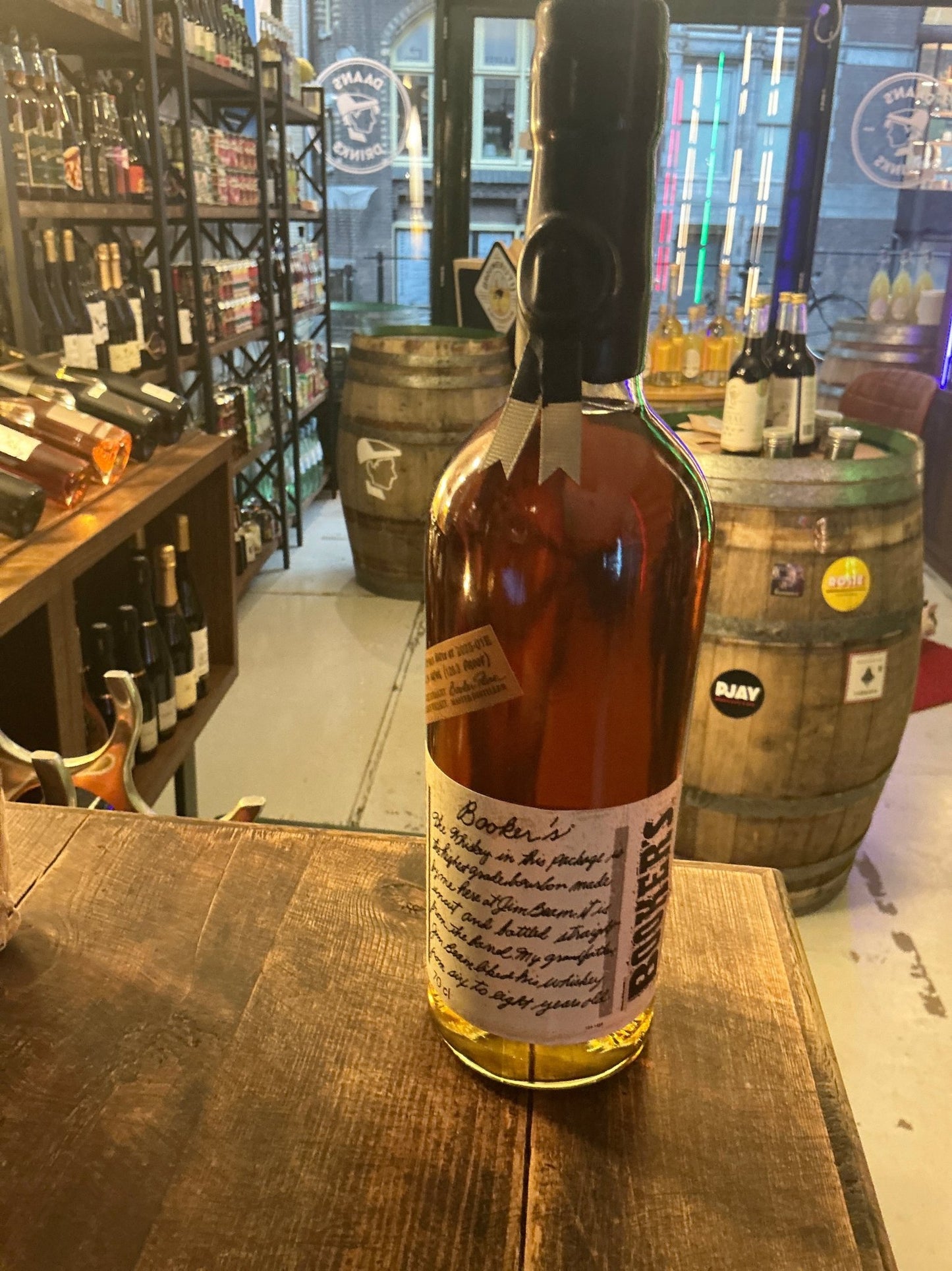 Booker’s 7 Year Bourbon small-batch artisan bottle with handwritten label, premium aged distilled Kentucky bourbon.