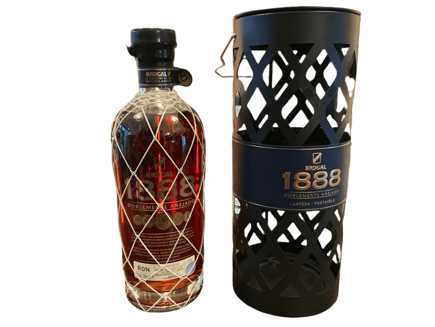 Brugal 1888 aged Dominican rum bottle with diamond-patterned stopper alongside black cylindrical artisan gift box with.