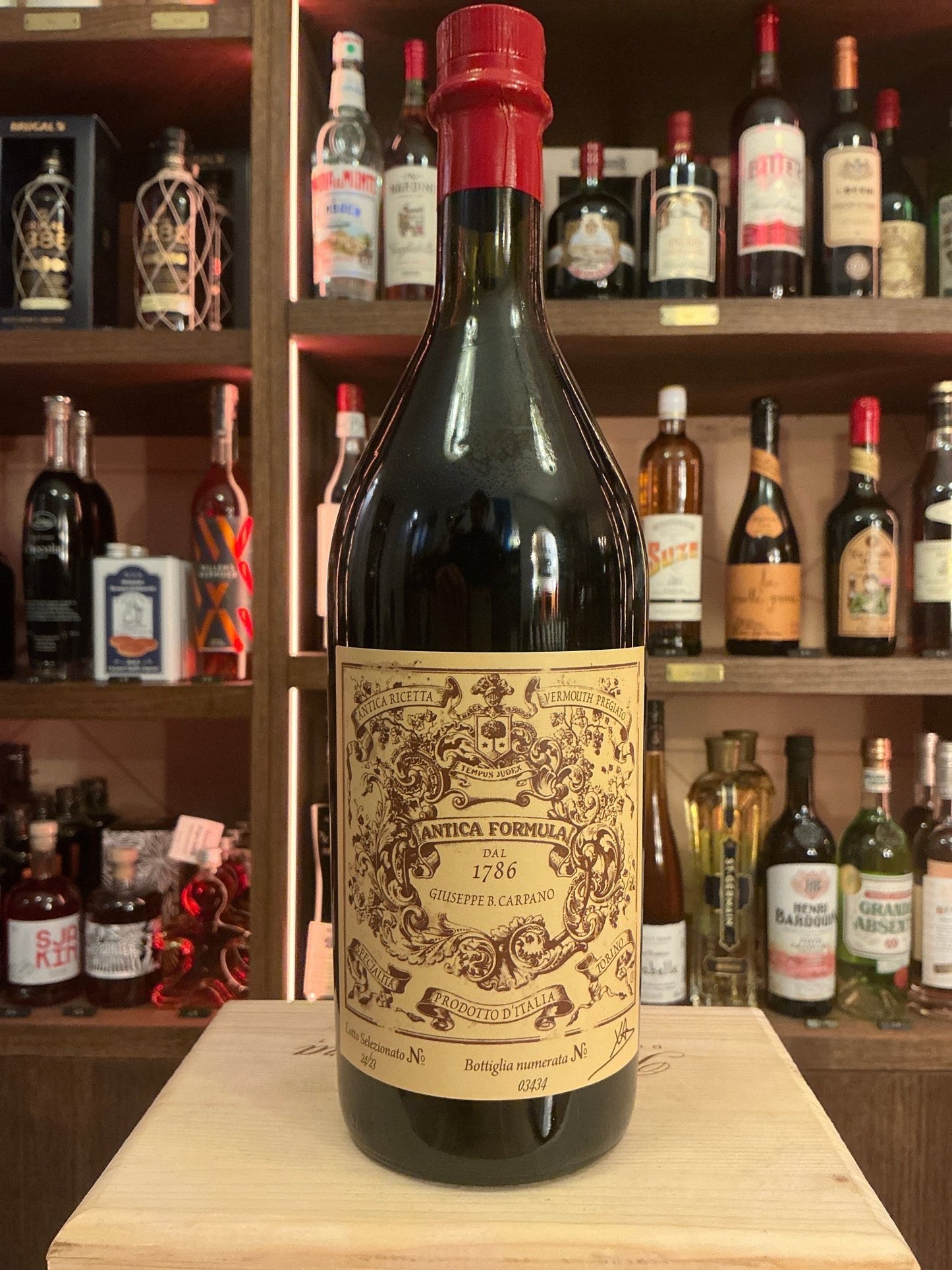 Carpano Antica Formula Vermouth bottle with vintage beige label and red wax seal, premium spiced Italian liqueur for gin,.