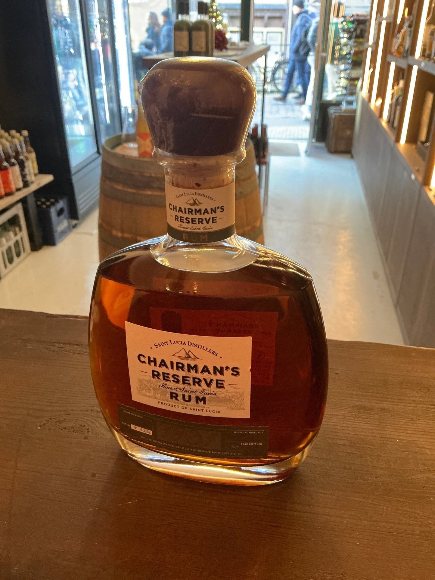 Chairman’s Reserve 1931 Caribbean rum in a clear bottle with cork stopper, rich amber color, premium aged artisanal spirit.