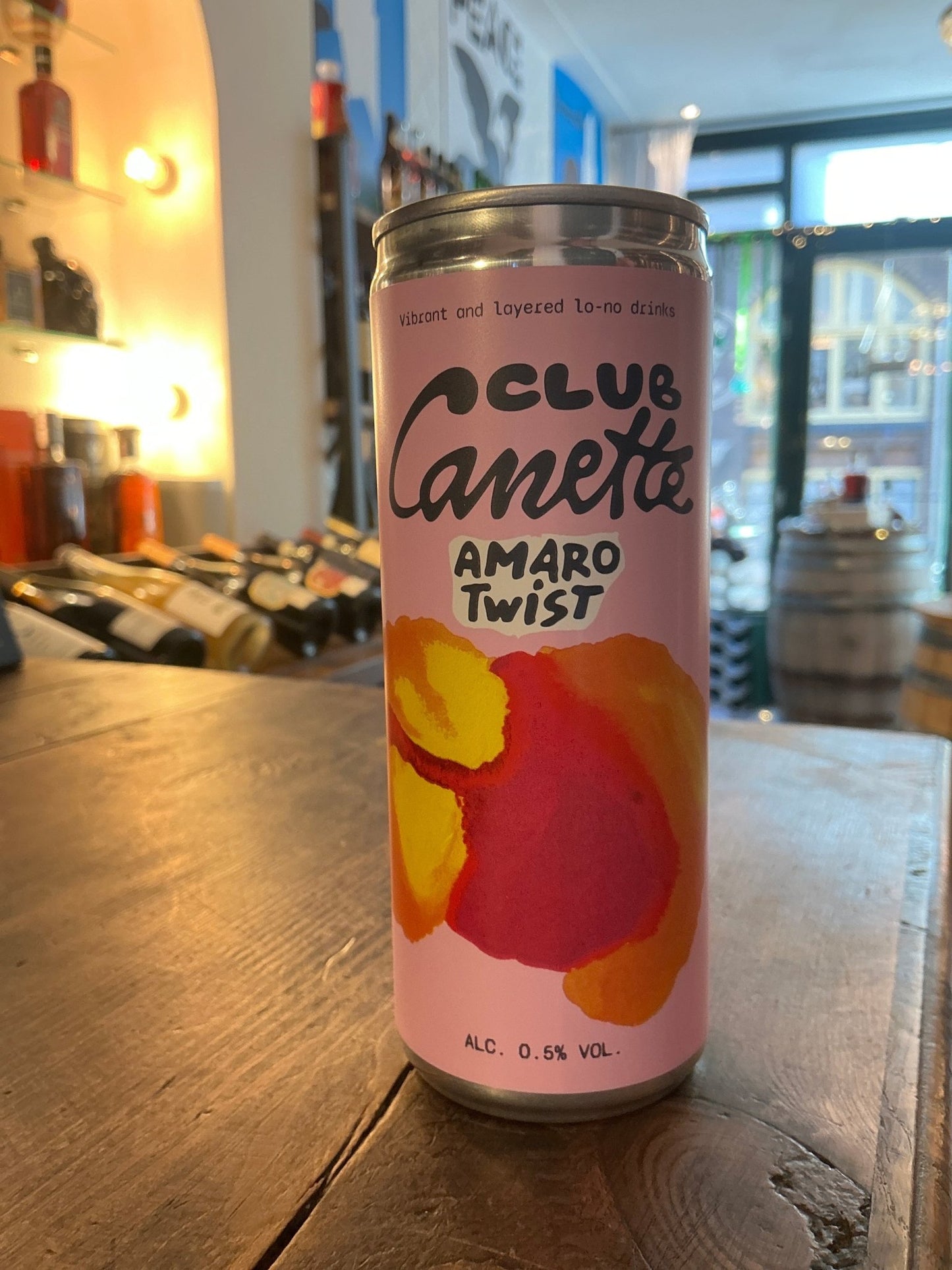 Club Canette Amaro Twist non-alcoholic aperitif can with colorful floral design, premium botanical liqueur alternative.