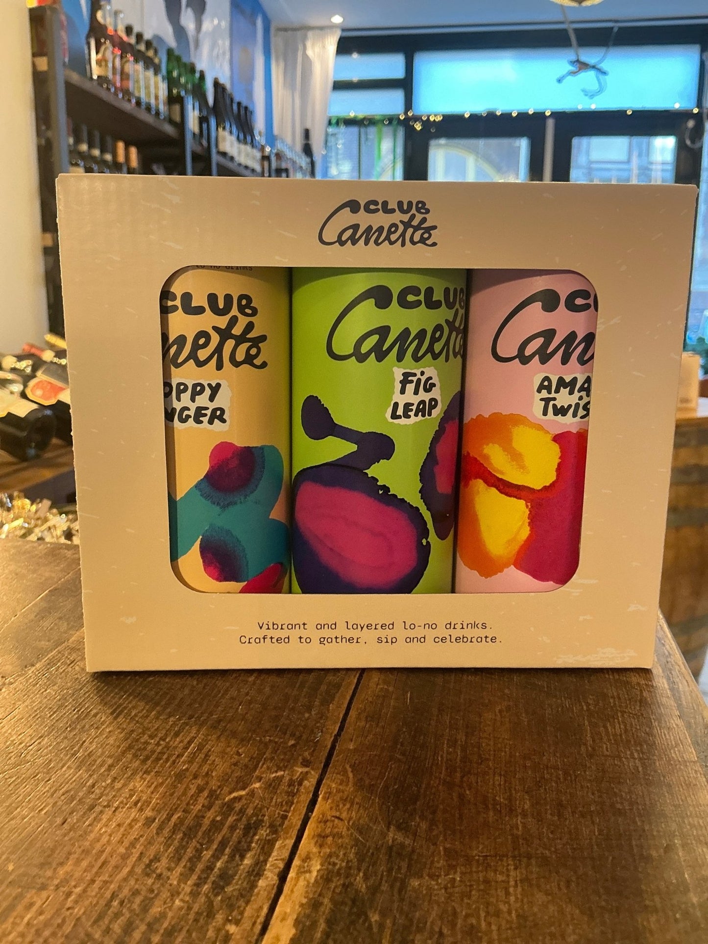 Club Canette giftbox with three colorful cans of artisan Dutch specialty spirits including botanical gin, spiced rum, and.