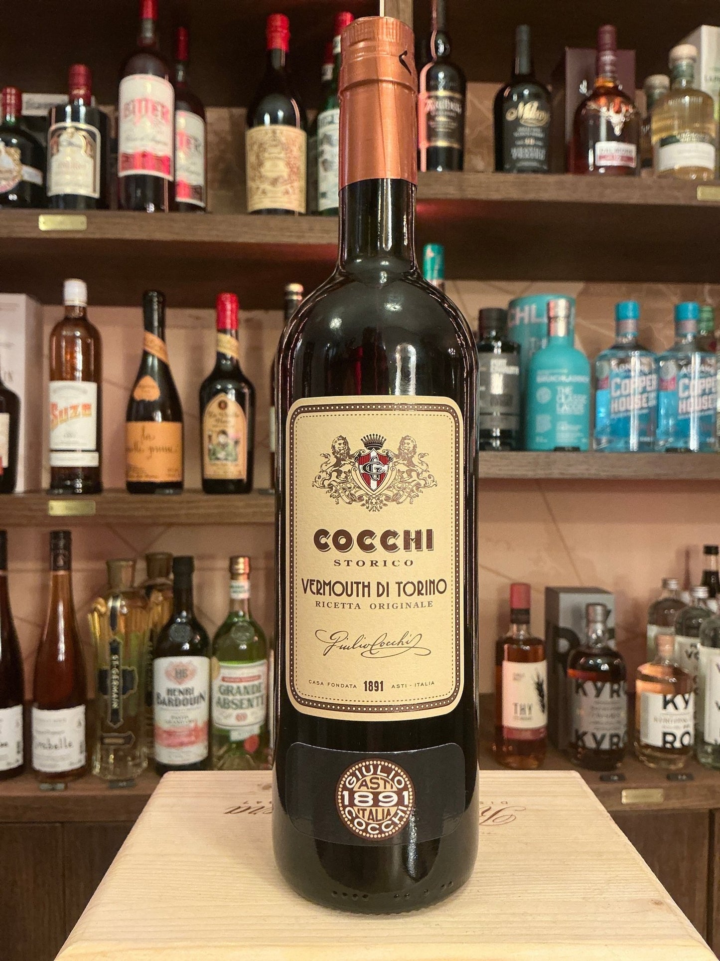Cocchi Americano aromatised wine bottle with vintage label, premium botanical liqueur, artisan small batch, displayed on.