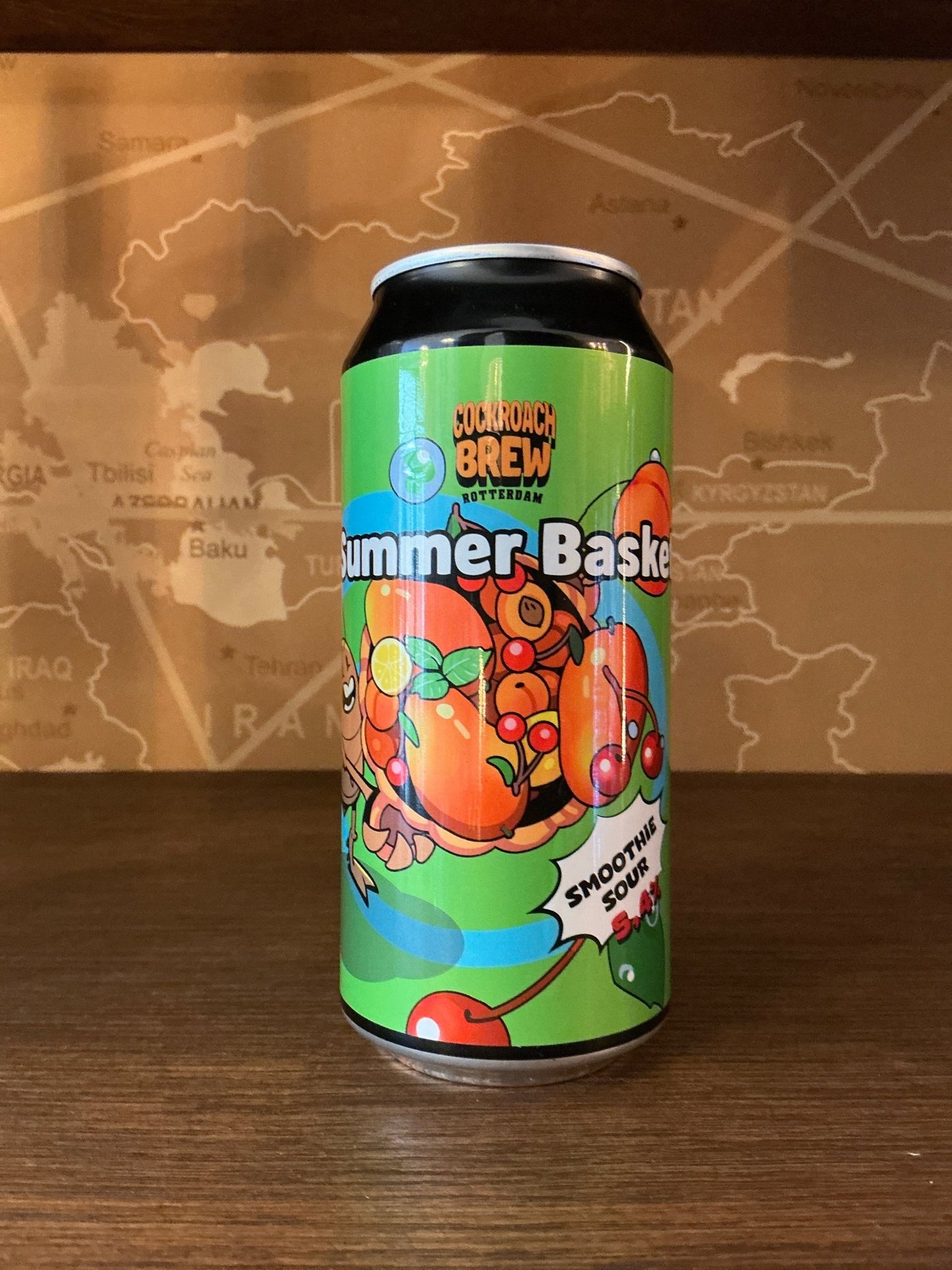Tall craft can of Cockroach Brew Summer Basket sour smoothie beer with vibrant orange and green label, featuring artisanal.