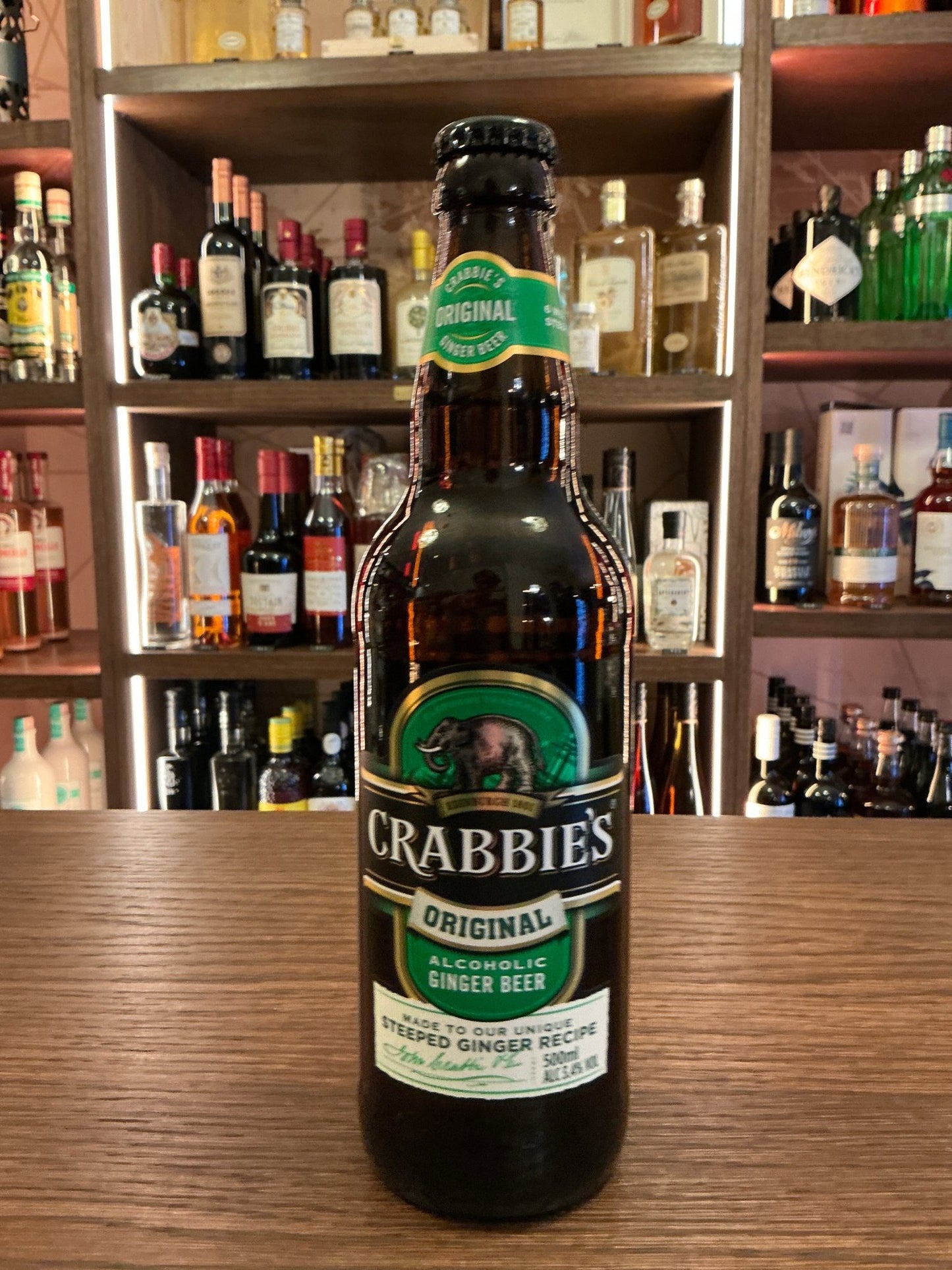 Crabbies Original Ginger Beer 50cl dark glass bottle with green and white label highlighting spiced botanical flavor,.