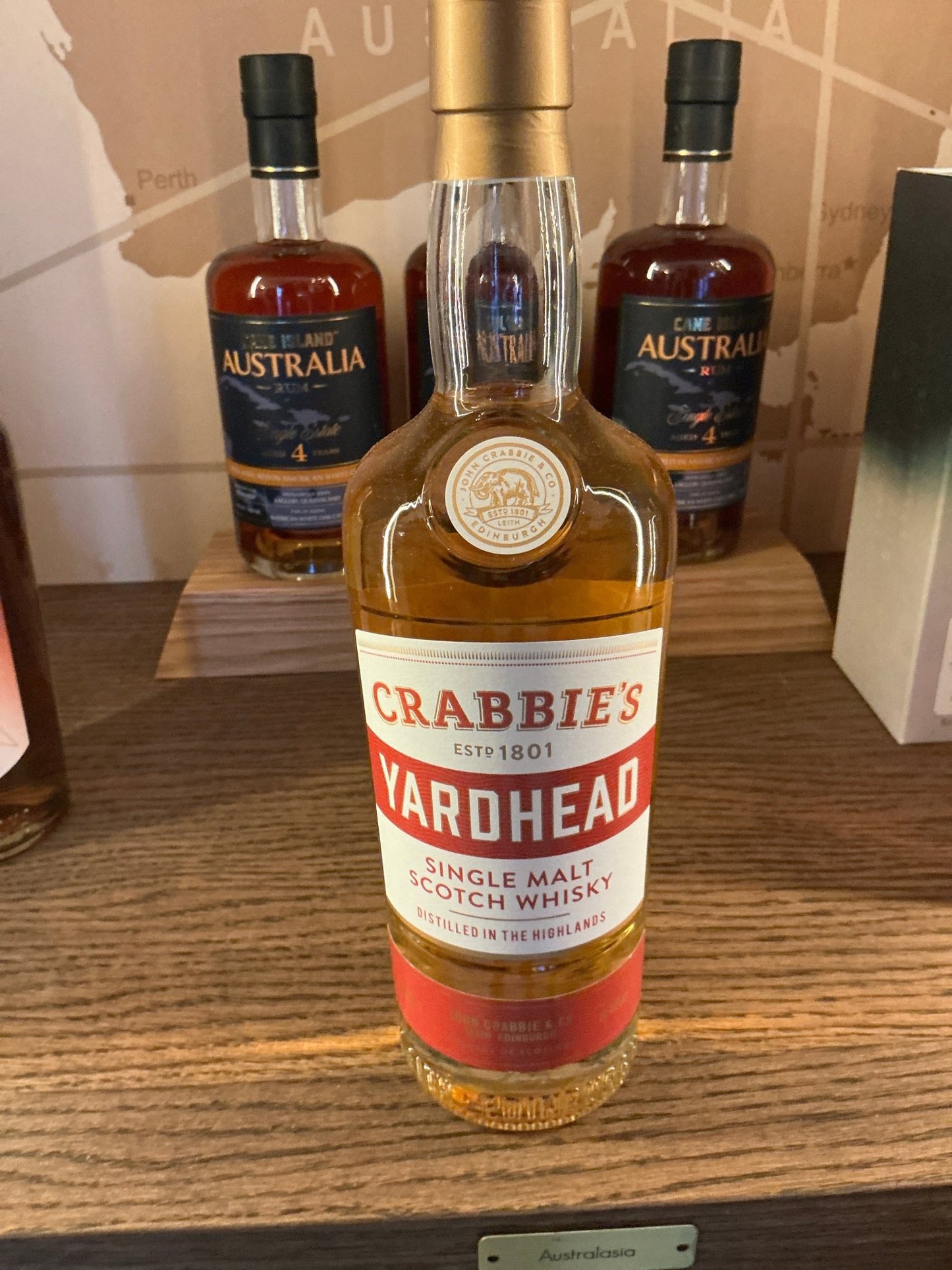 Crabbie’s Yardhead Single Malt whisky bottle with gold cap, amber liquid, premium aged artisan spirit label, small batch.