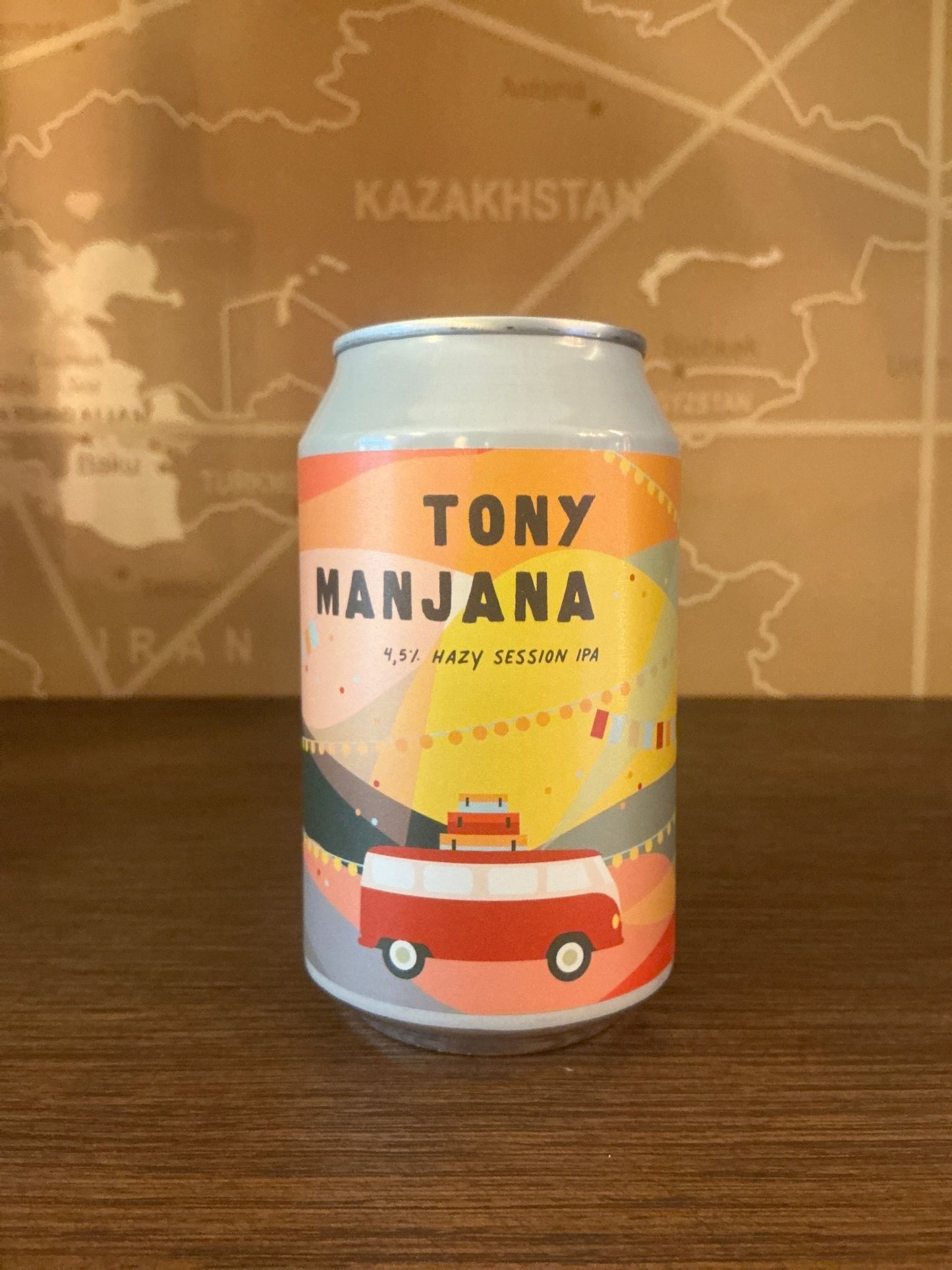 Slim aluminum can with colorful label featuring a pastel geometric design and an illustration of a red and orange vintage.