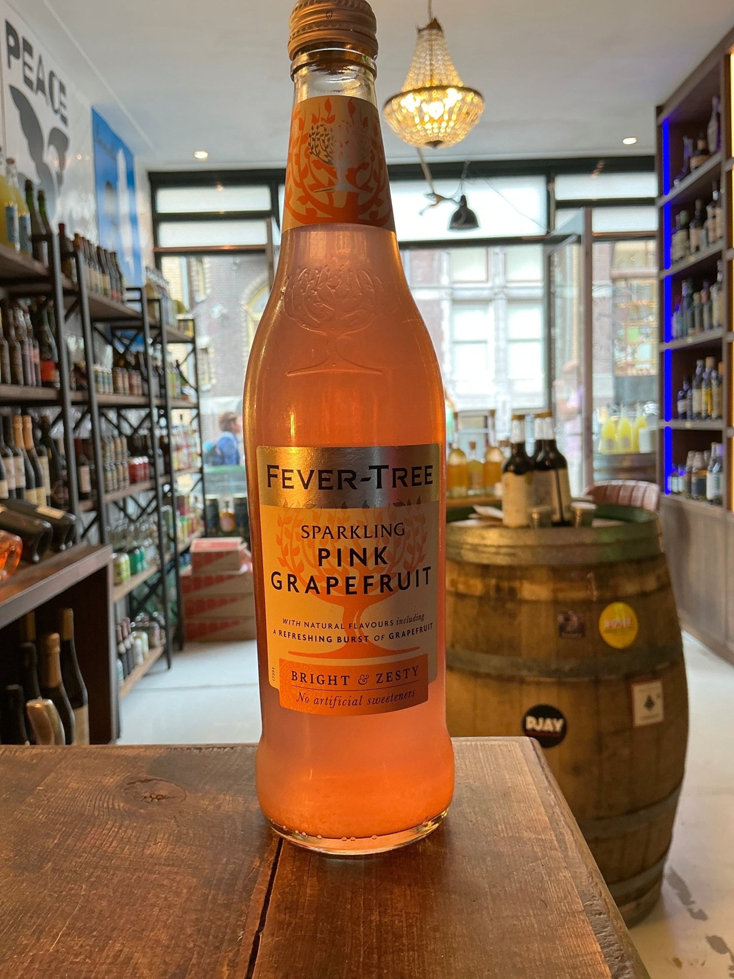 Fever Tree Sparkling Pink Grapefruit Soda 50cl glass bottle with orange-pink liquid, premium artisan mixer for gin, whisky,.