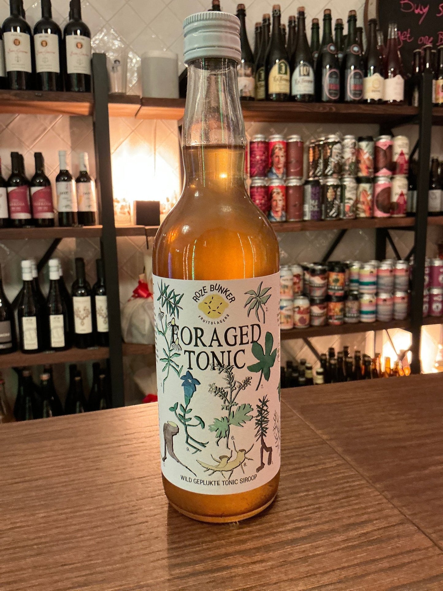 Foraged Tonic Big bottle with amber botanical spiced cordial, artisan small batch specialty spirits, Dutch crafted.
