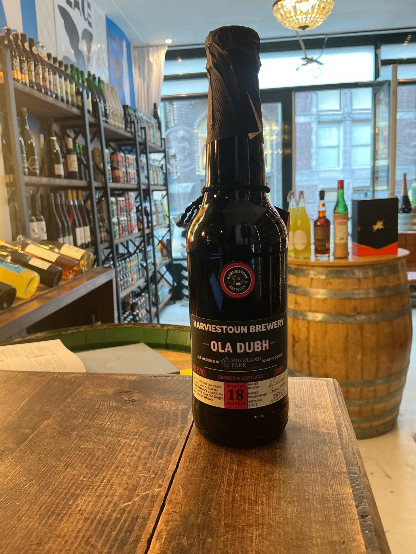 Harviestoun Brewery Ola Dubh 18 Year Special Reserve dark craft beer bottle with premium aged porter label on wooden table.