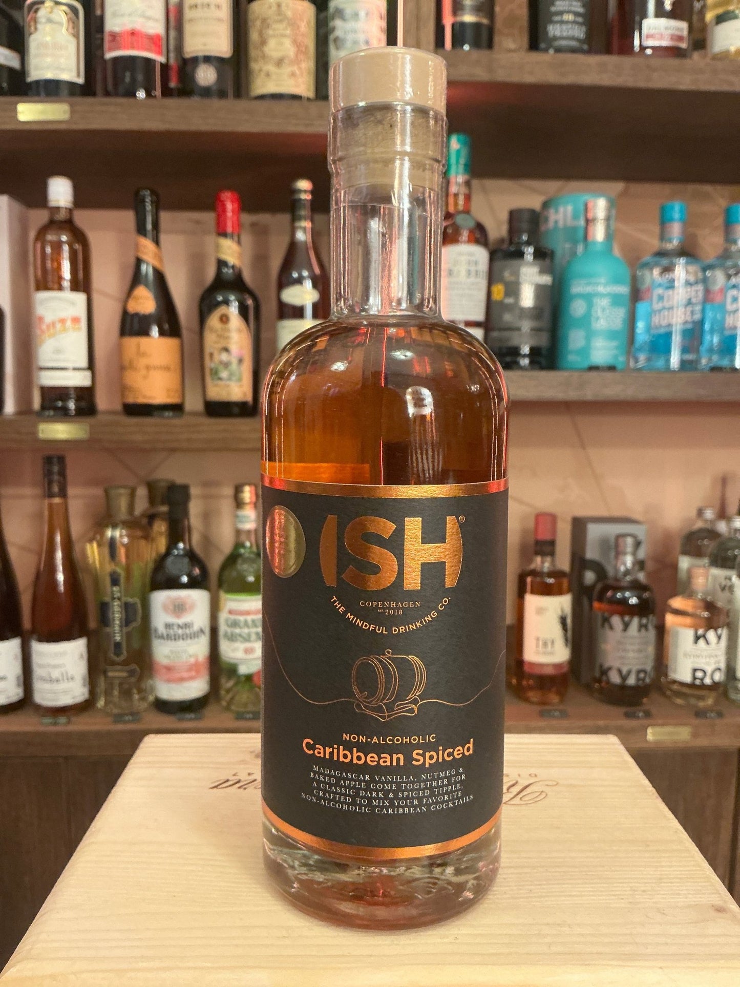 ISH Caribbean Spiced Spirit 0% bottle with amber liquid, black label featuring gold accents, premium non-alcoholic rum.