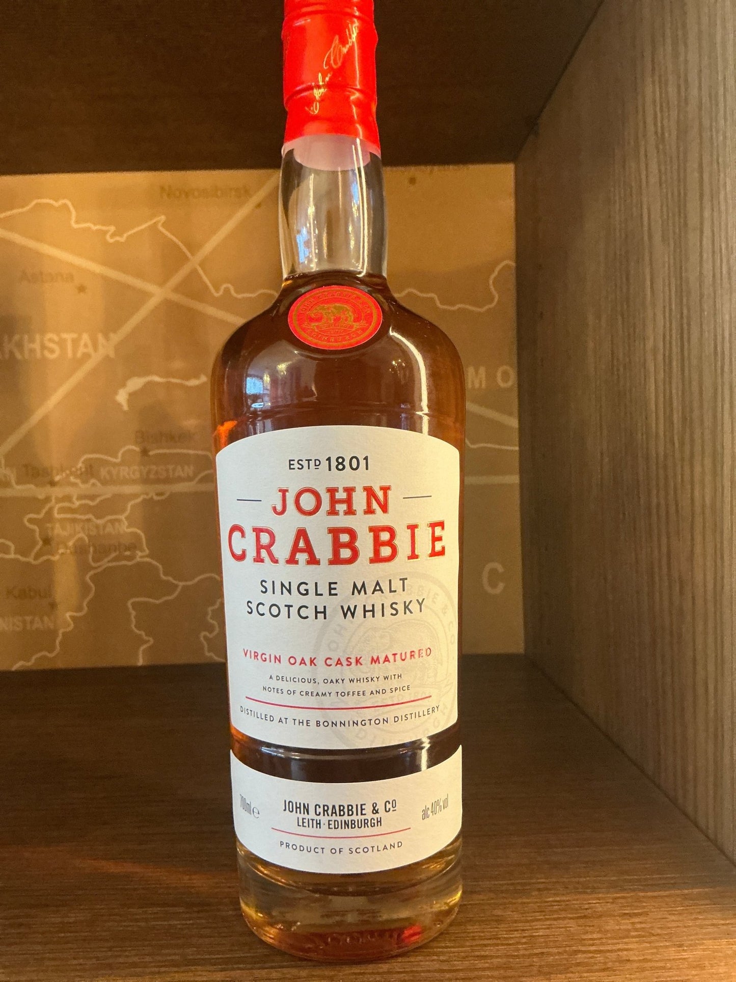 John Crabbie Single Malt Scotch Whisky bottle with red seal, premium artisanal peated Dutch craft spirit, limited edition.