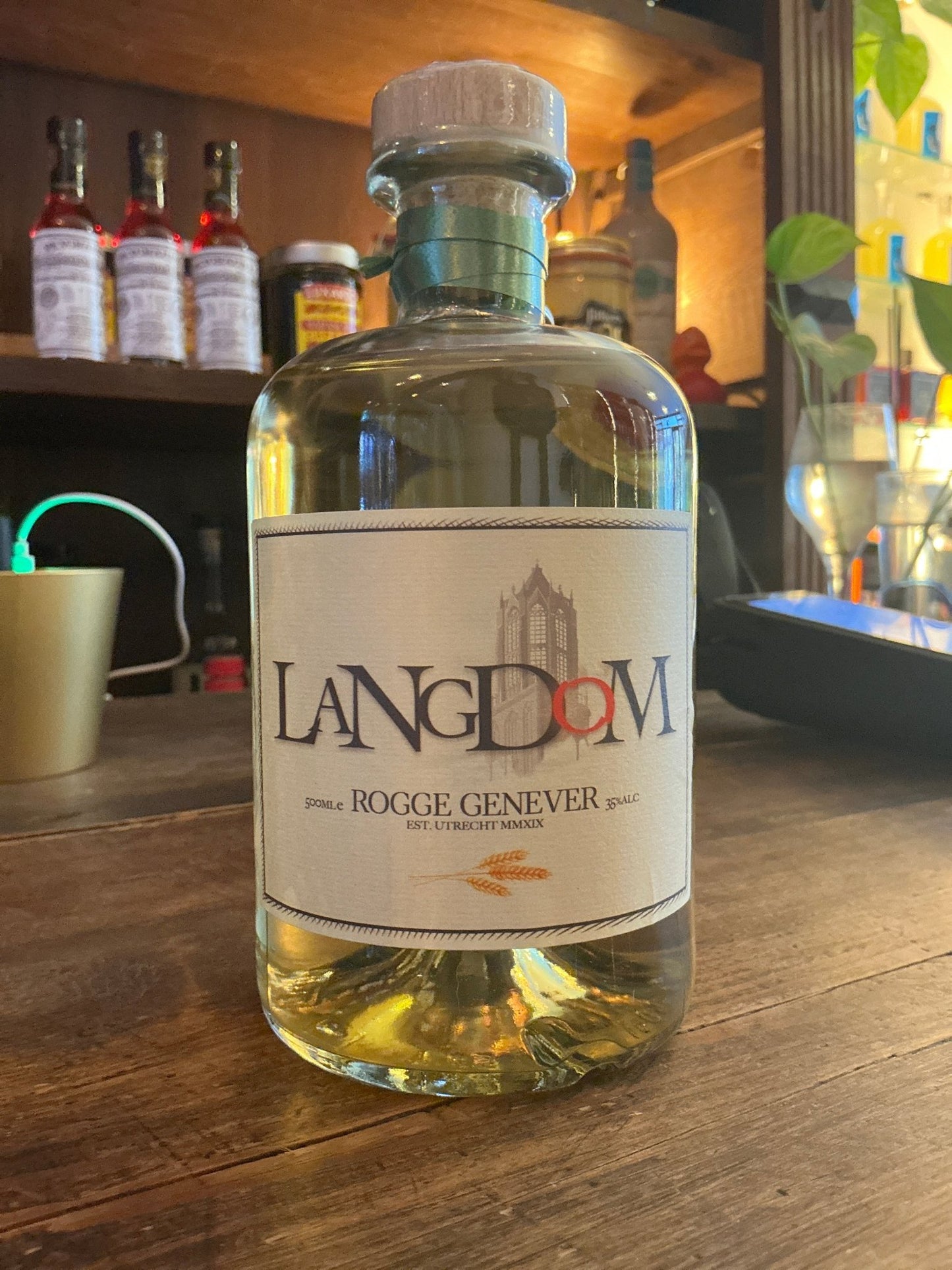 LangDom Rye Genever bottle with clear glass, wooden cork, and white label highlighting artisan Dutch specialty spirits and.