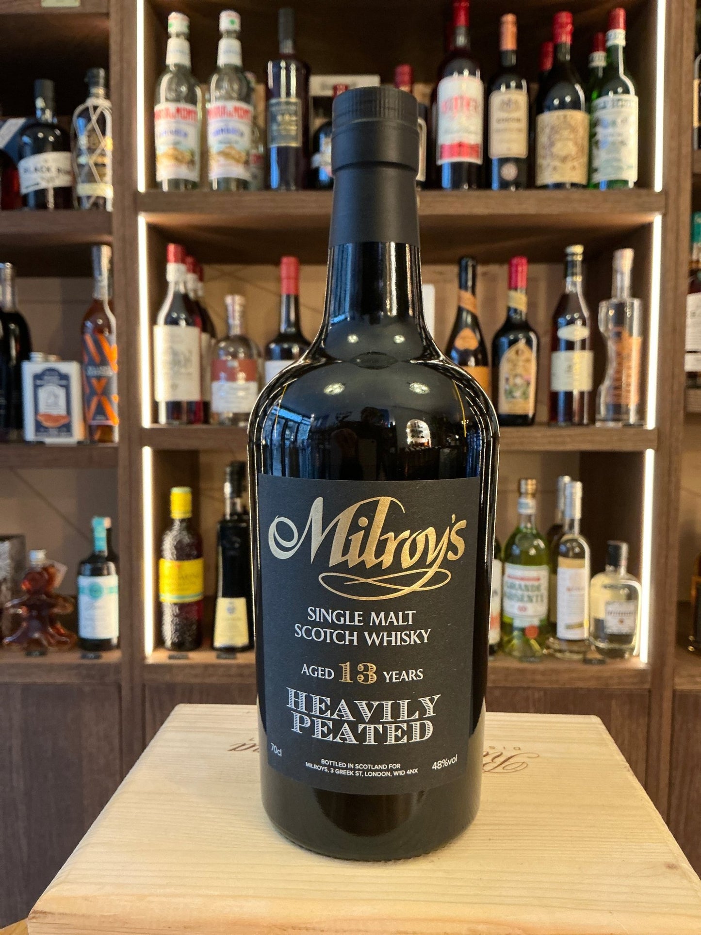 Milroy's Heavily Peated single malt whisky bottle, aged 13 years, premium small batch artisan spirit with rich smoky,.