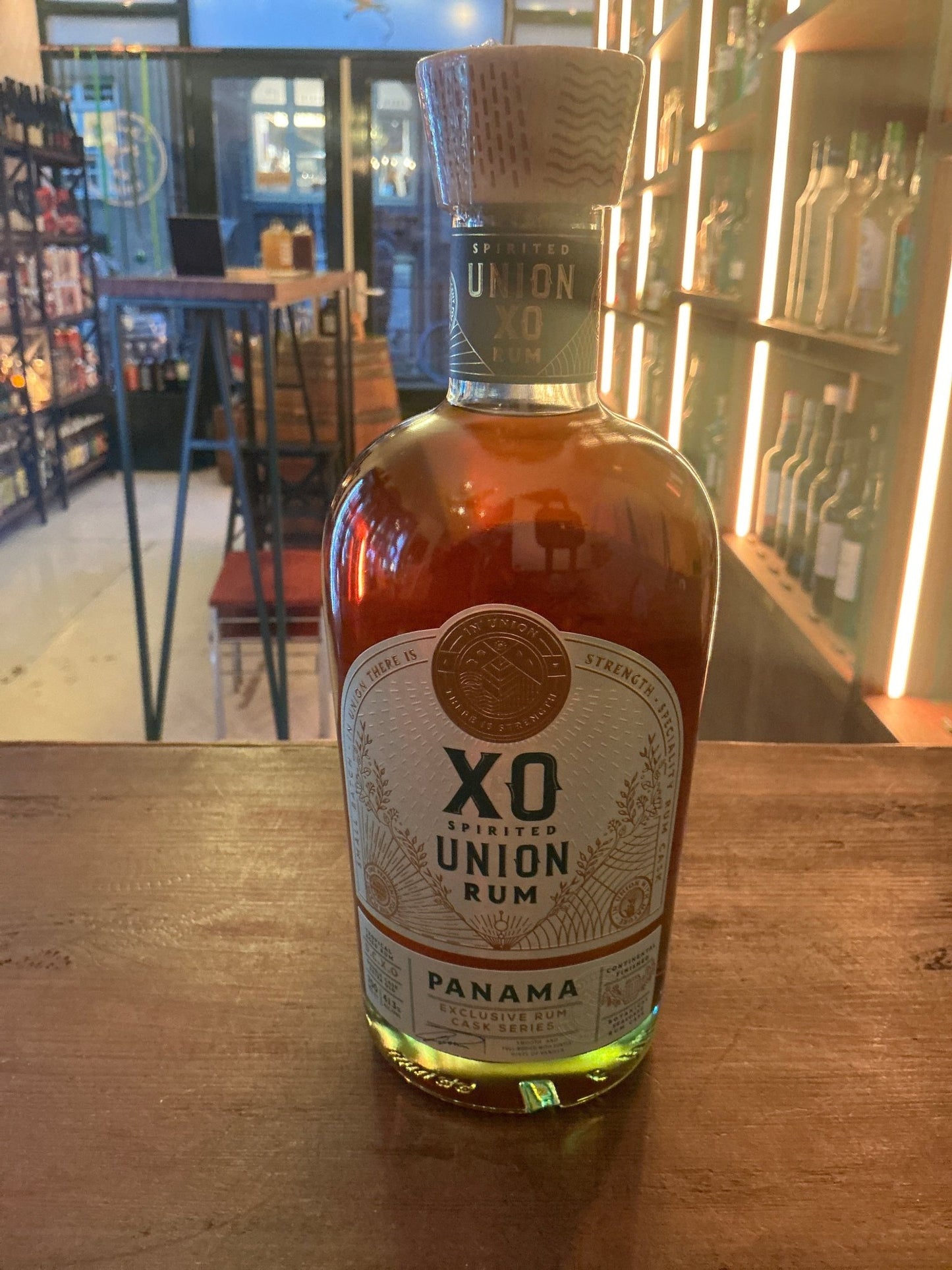 Spirited Union XO Panama aged rum bottle with amber liquid, artisan small batch premium distilled spirit.