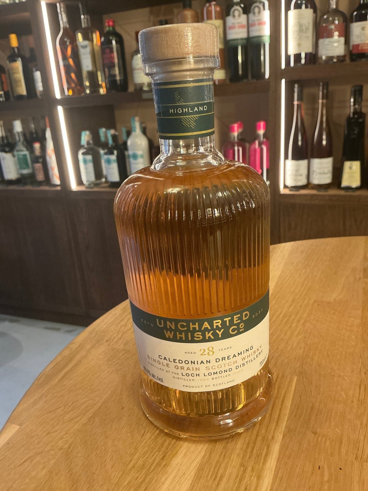Uncharted Whisky Caledonian Dreaming 28 Year Aged Loch Lomond Single Grain bottle with premium spiced and botanical.