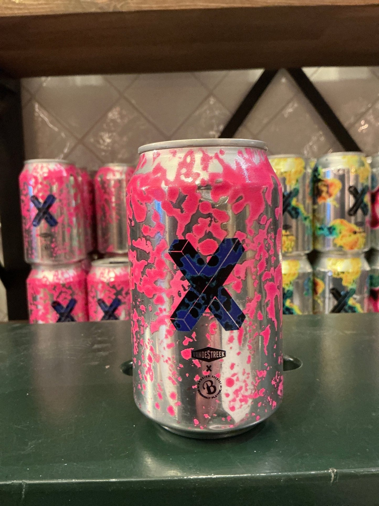 Pink and silver can of Van de Streek X Baxbier Barrel Collab Series #2 Imperial Fruited Sour craft beer with bold blue X and .