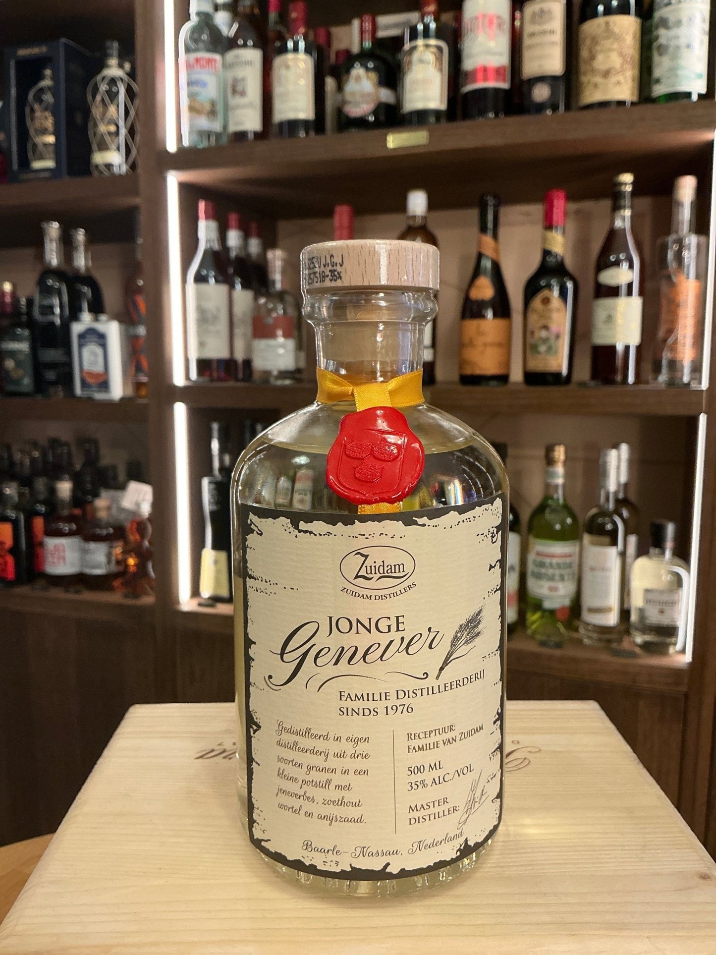 Zuidam Jonge Genever Dutch gin-style spirit in clear bottle with wax seal, botanical, small batch artisan specialty spirits.
