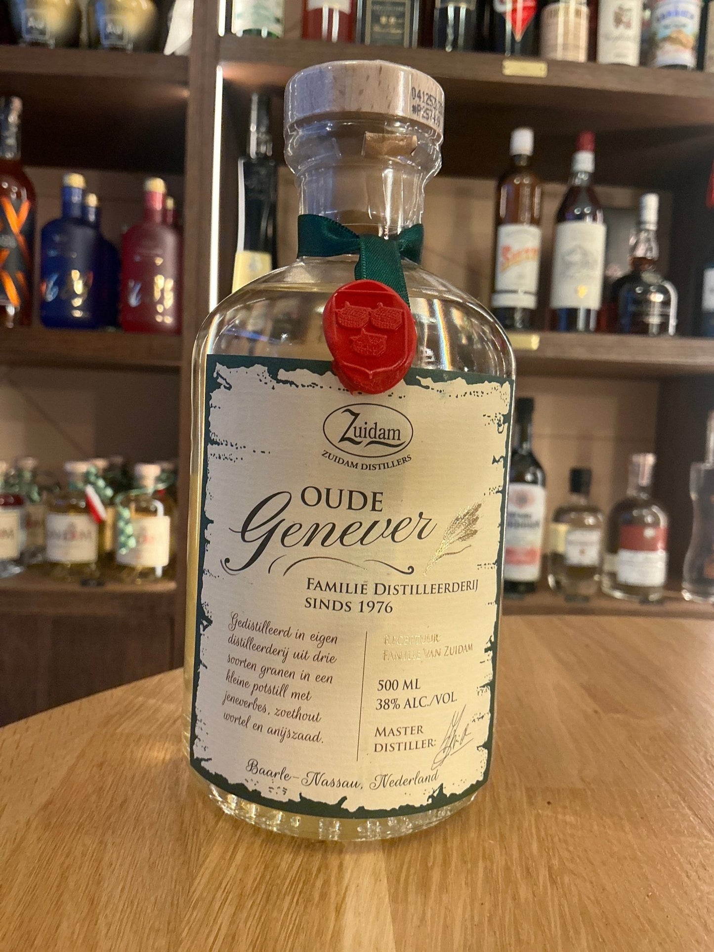 Zuidam Oude Genever Dutch gin-style spirit in small batch botanical bottle with red wax seal.
