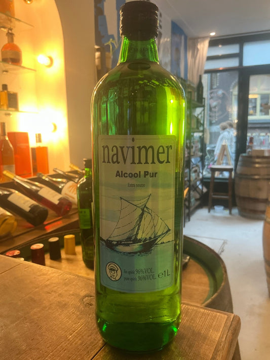Tall green glass bottle of Navimer Alcohol 96% pure neutral spirit with nautical sailboat label, artisan distilled for.