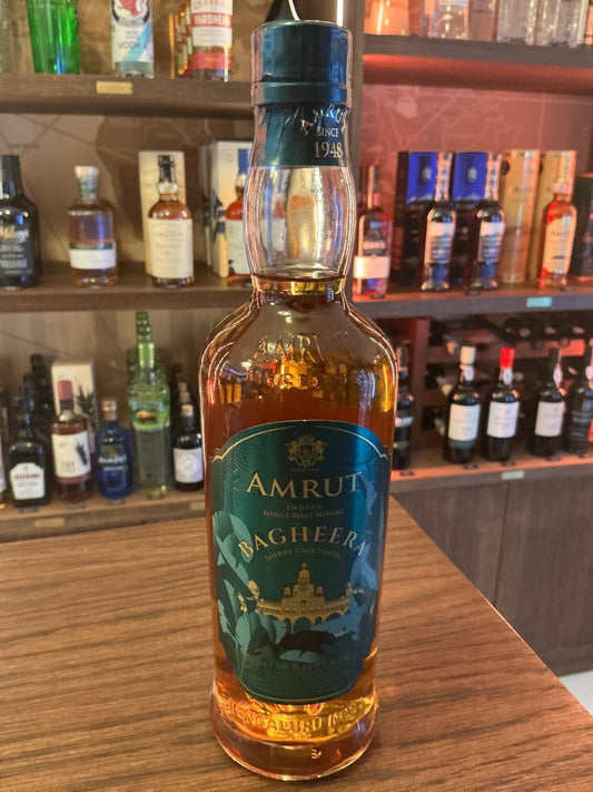 Amrut Bagheera Indian single malt whisky bottle with amber liquid, premium aged distilled spirit, artisan small batch.