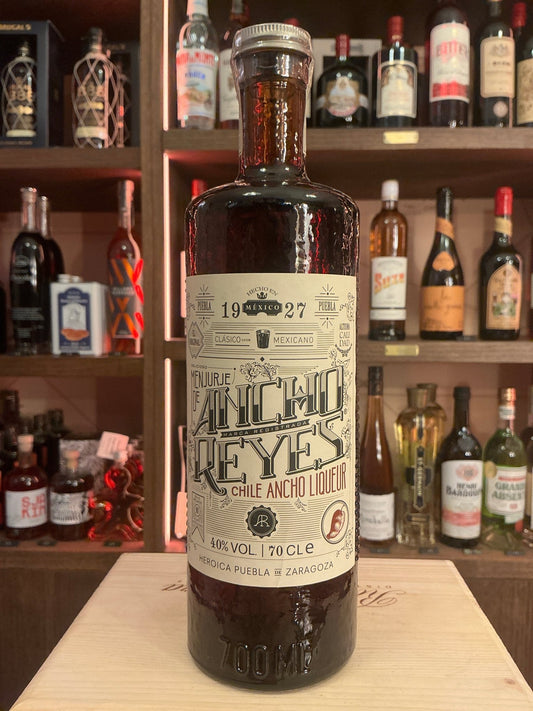 Ancho Reyes Chilli Ancho Liqueur bottle with spiced botanical label, premium artisan design, small batch specialty spirit.