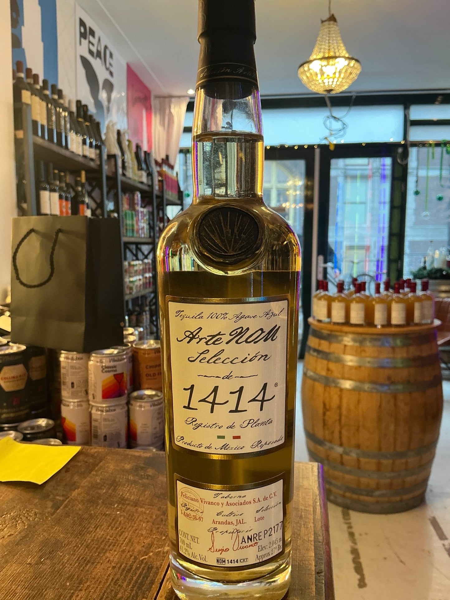 Arte Nom 1414 Reposado tequila bottle with aged, premium distilled spirit label, artisan craft detail.