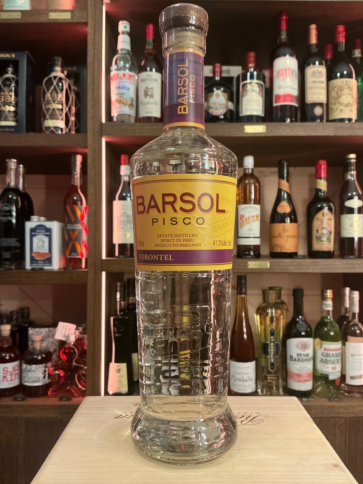 Barsol Selecto Torontel Pisco bottle with embossed clear glass and yellow label, premium Peruvian grape brandy, artisanal