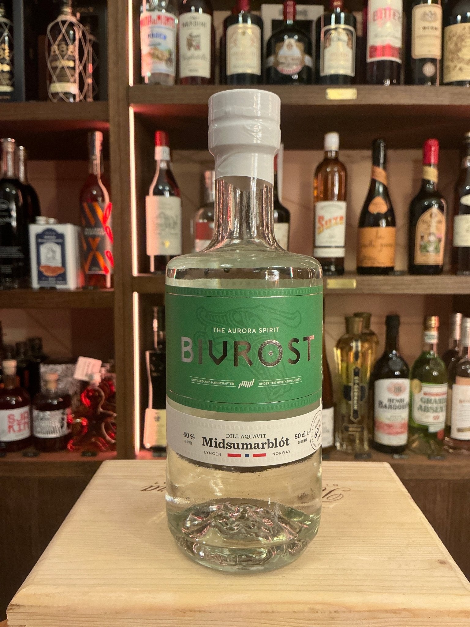 Bivrost Aquavit Dille clear glass bottle with green label highlighting botanical spiced specialty spirit, small batch Dutch.