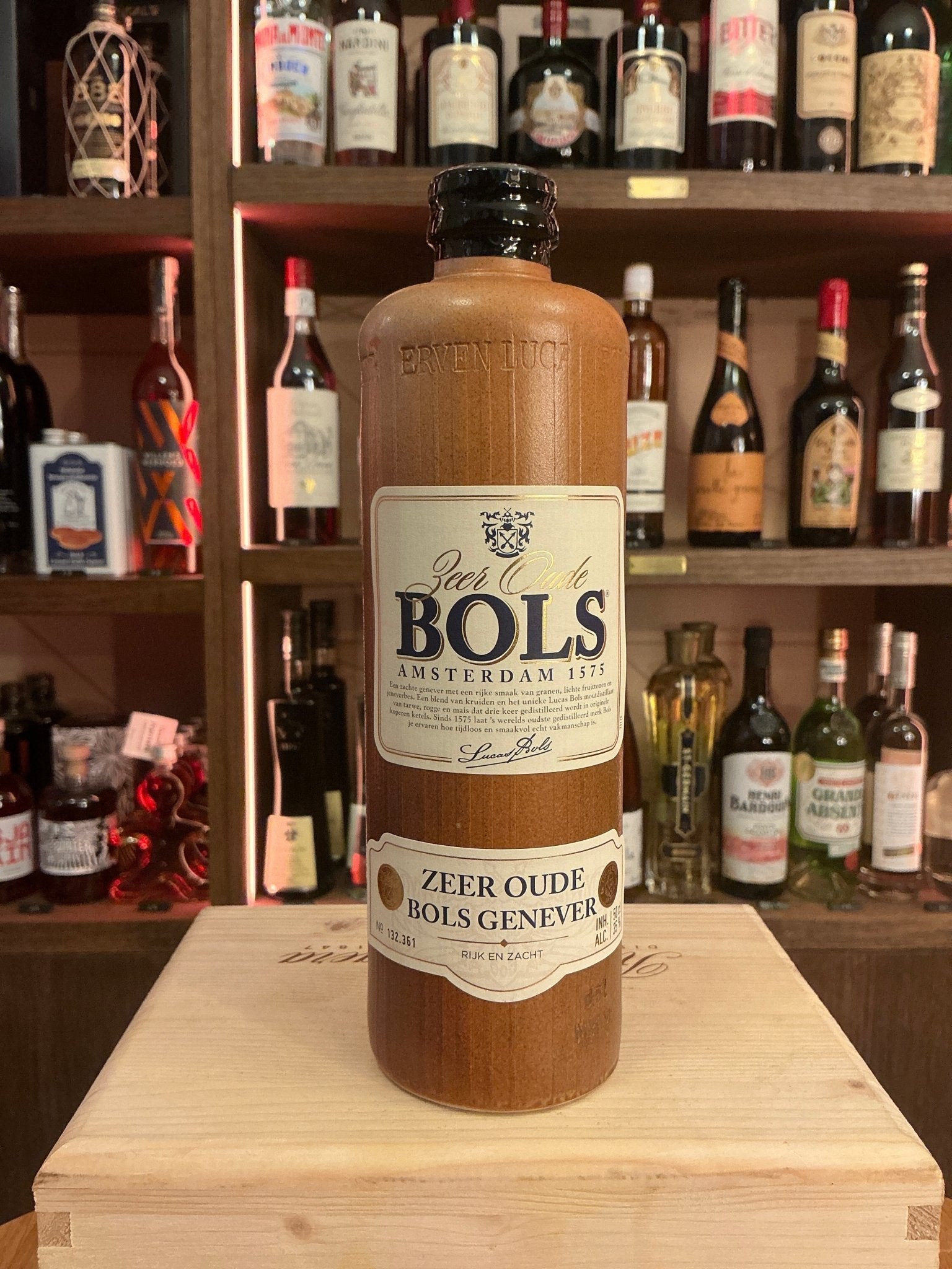 Premium Bols Oude Genever bottle in a rustic clay-style craft beer jug, showcasing Dutch aged botanical spirit with.