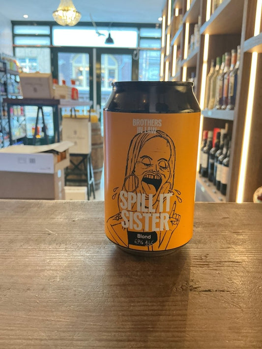 Brothers in Law Spill it Sister blonde ale craft beer can with orange label featuring illustrated woman and bold text,.