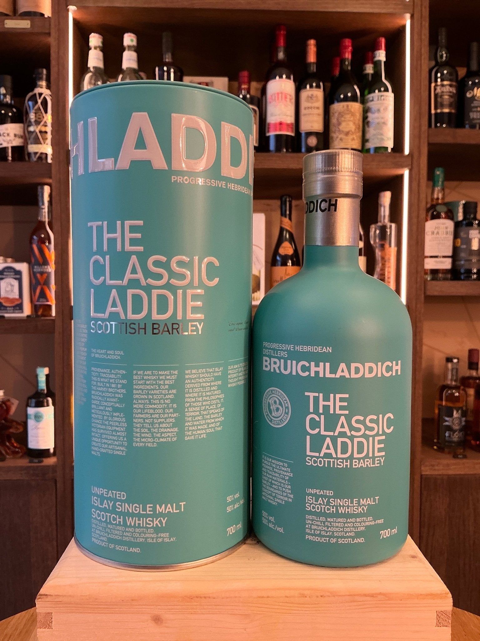 Bruichladdich The Classic Laddie single malt whisky bottle and teal cylindrical box with silver and white text, premium.