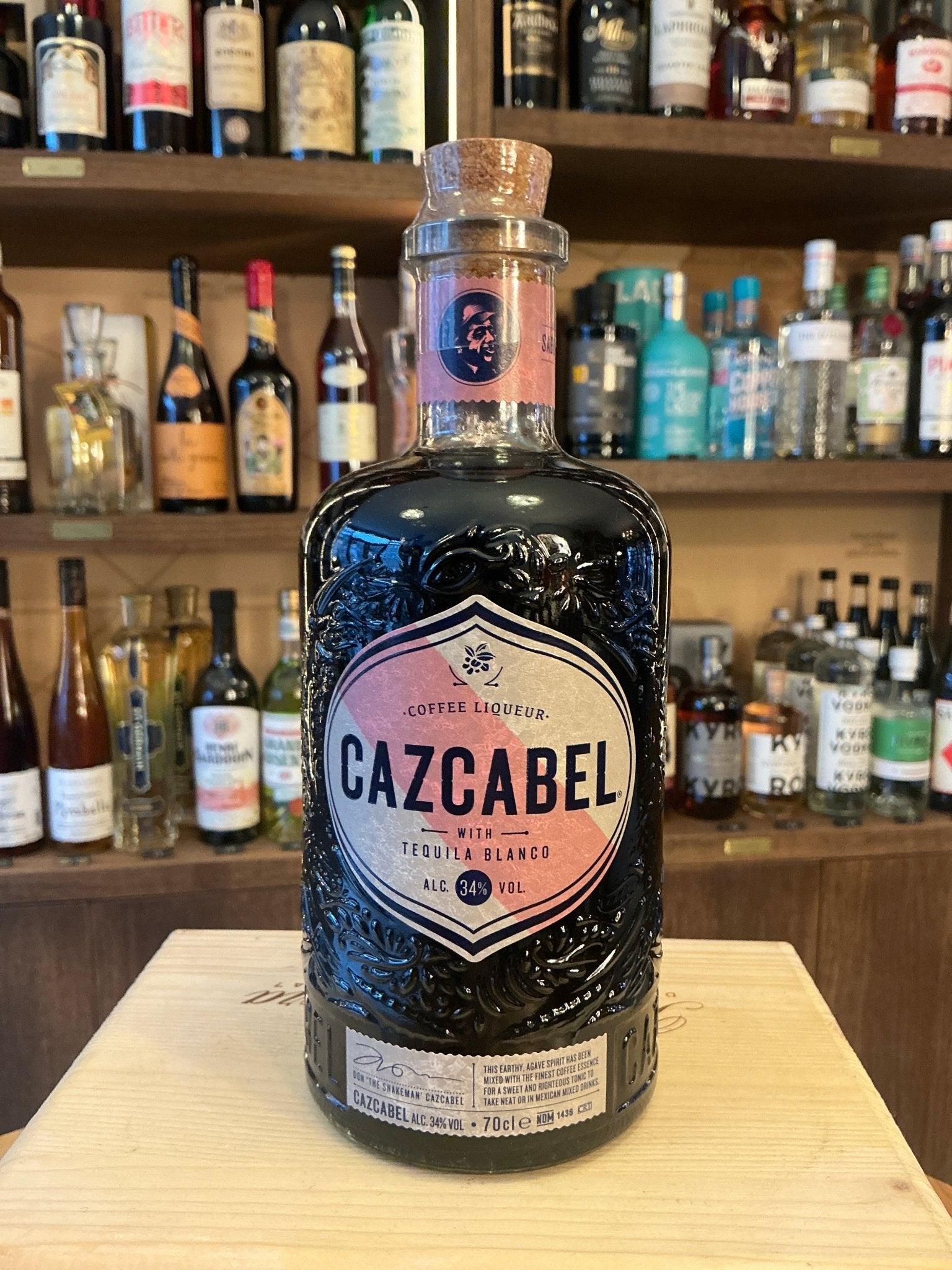 Cazcabel Tequila Coffee Liqueur bottle with embossed black glass and pink label, artisan small batch spirit.