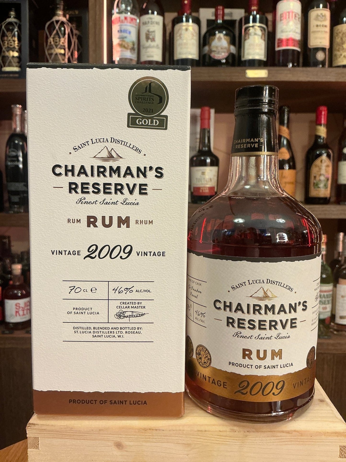 Chairman’s Reserve 2009 Vintage Rum bottle next to its cream and gold premium box, aged Caribbean rum with spiced artisan.