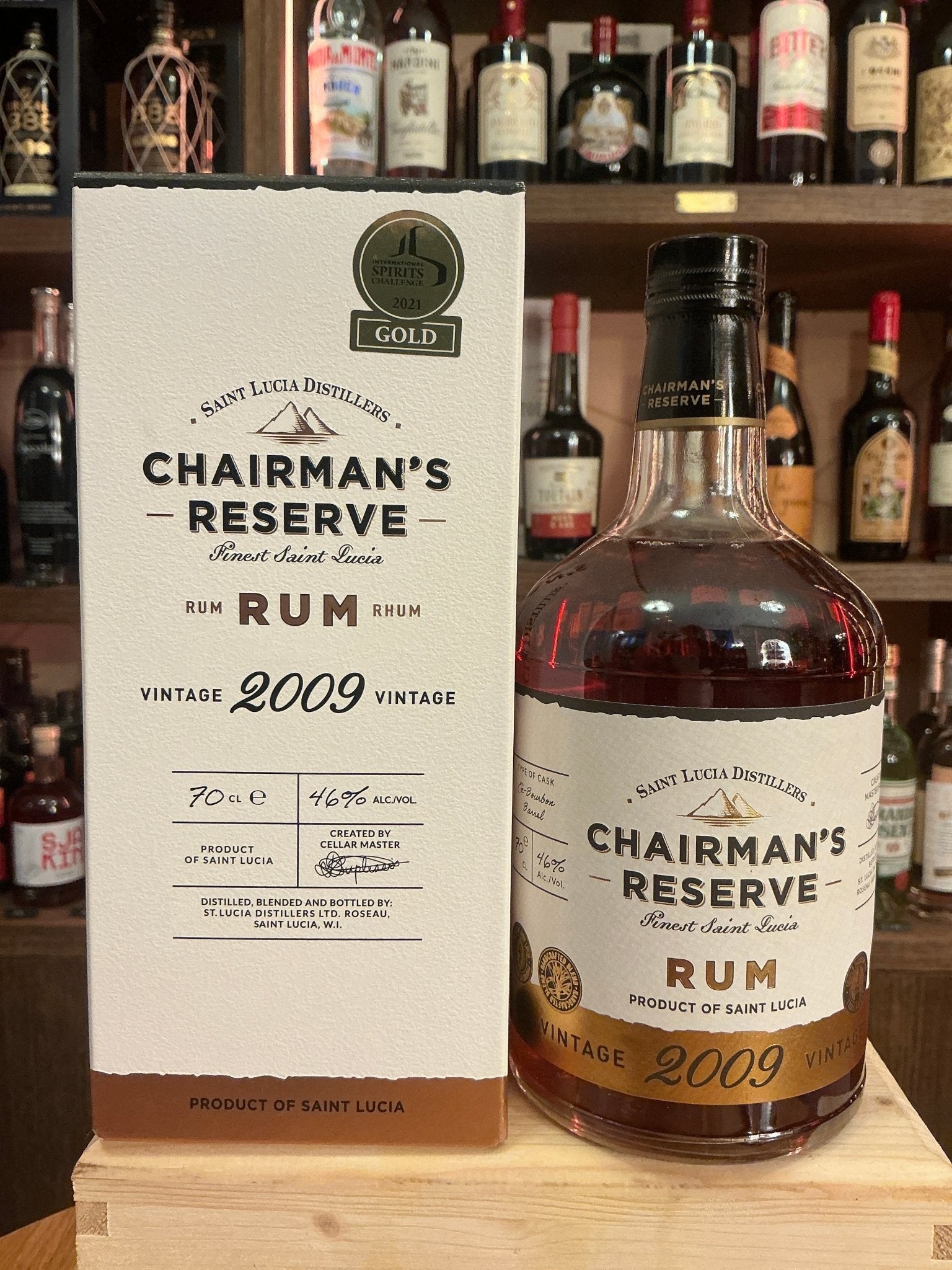 Chairman’s Reserve 2009 Vintage Rum bottle next to its cream and gold premium box, aged Caribbean rum with spiced artisan.