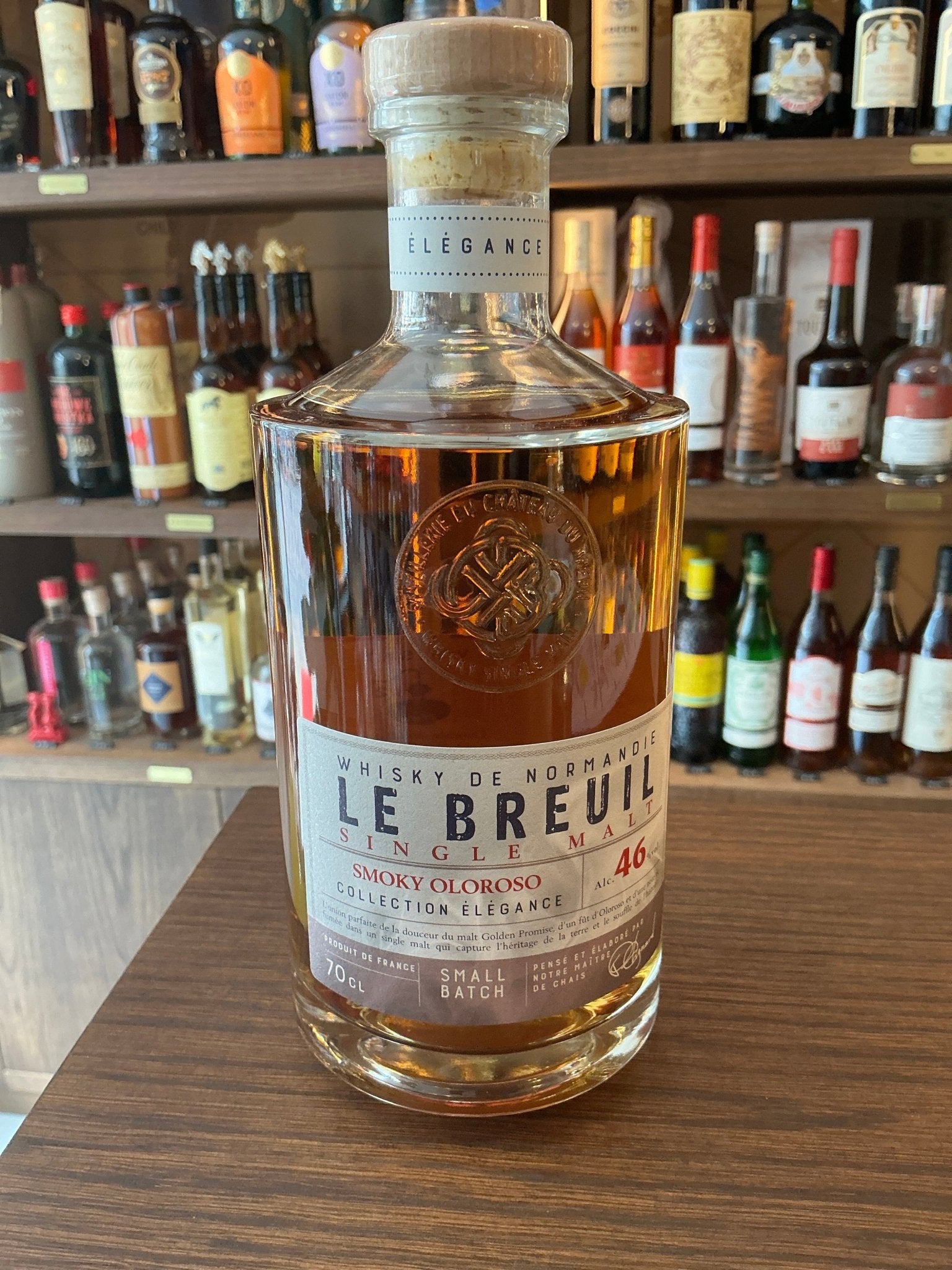 Chateau du Breuil Le Breuil Smokey Oloroso single malt whisky bottle with amber liquid, small batch artisan crafted, premium .