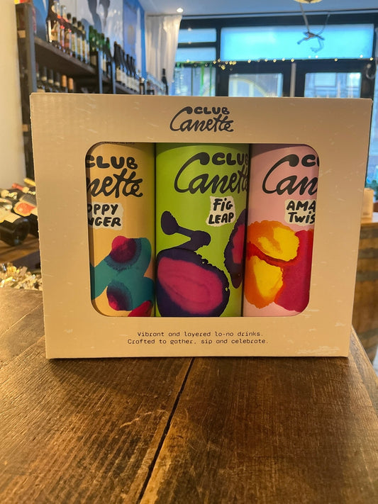 Club Canette giftbox with three colorful cans of artisan Dutch specialty spirits including botanical gin, spiced rum, and.