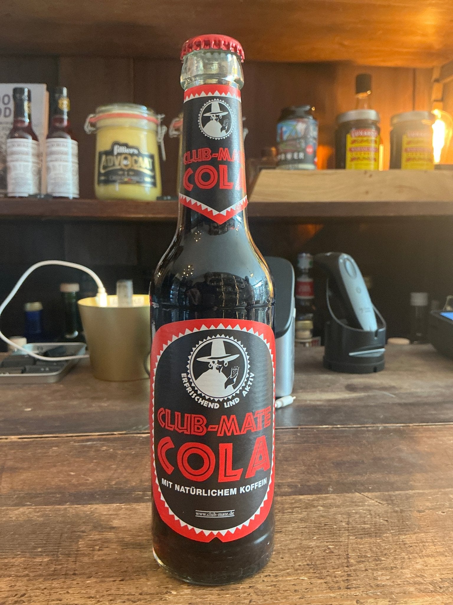 Club Mate Cola glass bottle with red and black label, premium artisan botanical cola blend for spirits and craft beer mixers.