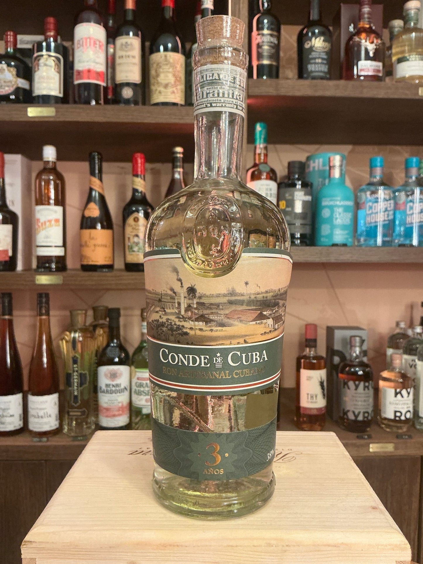 Clear glass bottle of Conde de Cuba 3 Year Old aged Cuban rum with black and gold label, premium artisan small batch.