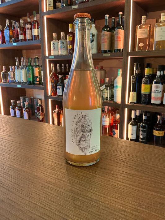 Cul Sec Balade Minérale Blanc non-alcoholic wine bottle with minimalist white label featuring intricate botanical design,.