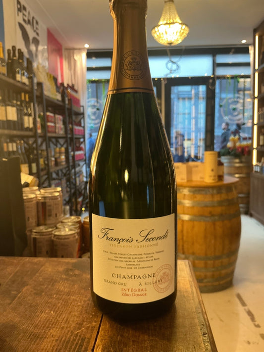 François Secondé Grand Cru Brut champagne bottle with elegant gold foil top and cream label, premium aged sparkling wine in.