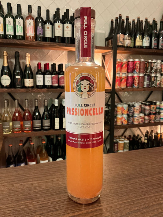 Tall slender bottle of Full Circle Passioncelli passionfruit liqueur with orange liquid, labeled artisan Dutch specialty.