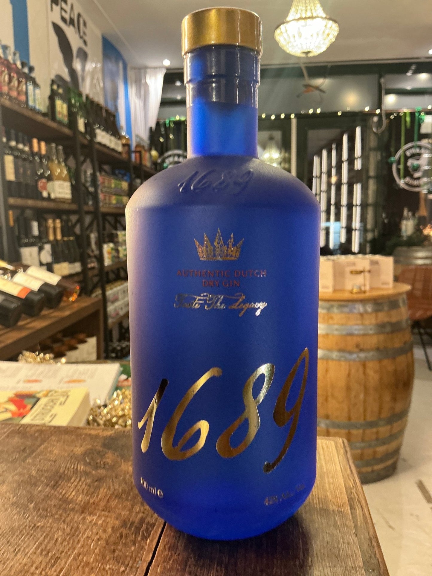 Gin 1689 frosted blue bottle with gold lettering — premium Dutch London Dry-style gin inspired by a 17th-century recipe
