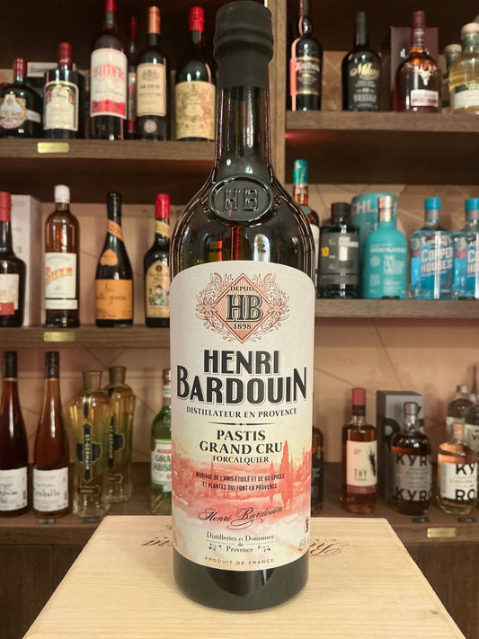 Henri Bardouin Pastis bottle with botanical, spiced French liqueur, premium artisan specialty spirit on wooden shelf.
