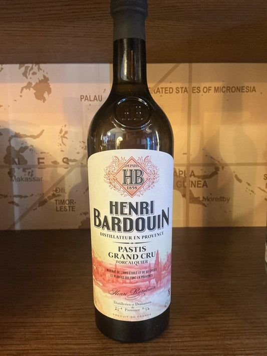 Henri Bardouin Pastis bottle with botanical, spiced French liqueur, premium artisan specialty spirit on wooden shelf.
