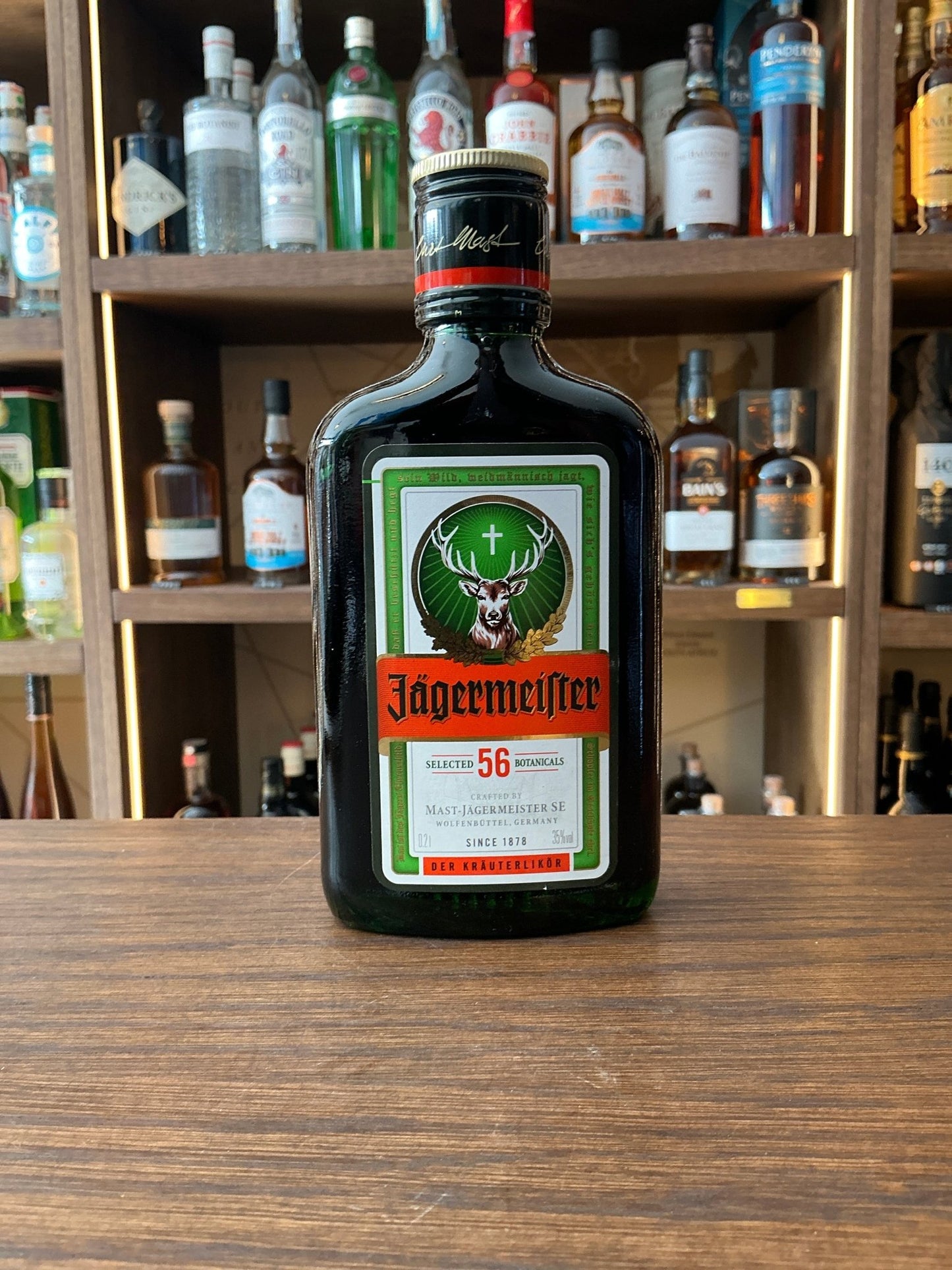 Jägermeister 20cl herbal liqueur bottle with iconic green glass, orange label and stag logo, German herbal spirit 35% ABV